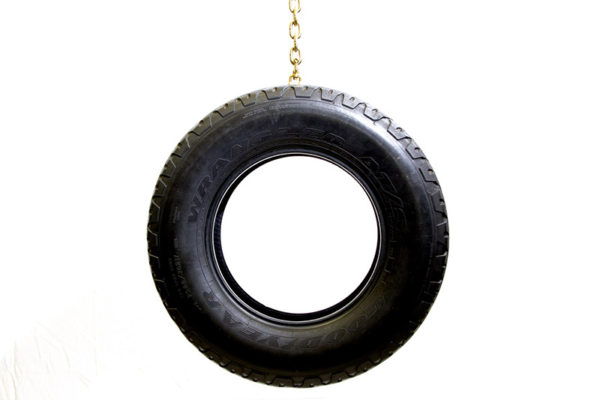 Aaron Young, <em>Tire Swing</em>, 2009, Gold plated chain, Used tire, Tire 30 in. diameter, Chain 72 in. length, Courtesy the Artist and Nathalie Karg/Cumulus Studios.