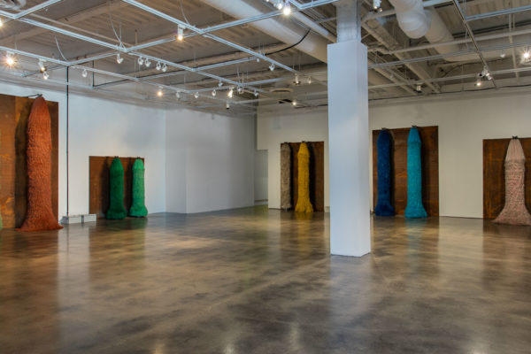 Lara Favaretto, <em>Coppie Semplici / Simple Couples</em>, 2009, Iron slabs, motors, electrical boxes, carwash brushes, wires, Installation dimensions variable, Museum of Contemporary Art Santa Barbara, 2019, Courtesy MCASB, Photo: Brian Forrest.