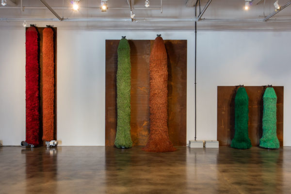 Lara Favaretto, <em>Coppie Semplici / Simple Couples</em>, 2009, Iron slabs, motors, electrical boxes, carwash brushes, wires, Installation dimensions variable, Museum of Contemporary Art Santa Barbara, 2019, Courtesy MCASB, Photo: Brian Forrest.