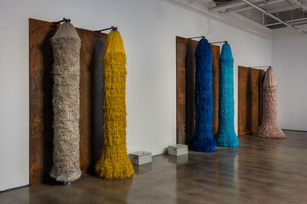 Lara Favaretto, <em>Coppie Semplici / Simple Couples</em>, 2009, Iron slabs, motors, electrical boxes, carwash brushes, wires, Installation dimensions variable, Museum of Contemporary Art Santa Barbara, 2019, Courtesy MCASB, Photo: Brian Forrest.