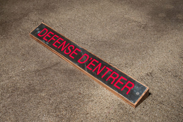 Lara Favaretto, <em>Défense d’Entrer / Do Not Enter</em>, Silver, enamel paint, zebrawood, 1 1/4 x 20 1/4 x 2 1/4 in (3.2 x 51.4 x 5.7 cm), Museum of Contemporary Art Santa Barbara, 2019, Courtesy MCASB, Photo: Brian Forrest.