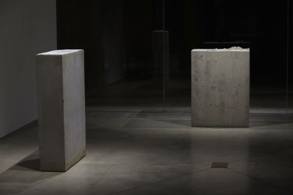 Lara Favaretto, <em>Boring</em>, 2010, Concrete, iron, 43 1/4 x 31 1/2 x 9 7/8 in (109.8 x 80 x 25 cm), and Lara Favaretto, <em>Fisting</em>, 2012 Concrete, iron, 39 1/8 x 17 1/4 x 29 1/4 in (99.4 x 43.8 x 74 cm), Glass Box Gallery, University California Santa Barbara, 2019, Courtesy MCASB, Photo: Alex Blair.