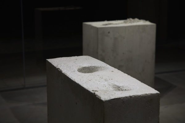 Lara Favaretto, <em>Boring</em>, 2010, Concrete, iron, 43 1/4 x 31 1/2 x 9 7/8 in (109.8 x 80 x 25 cm), and Lara Favaretto, <em>Fisting</em>, 2012 Concrete, iron, 39 1/8 x 17 1/4 x 29 1/4 in (99.4 x 43.8 x 74 cm), Glass Box Gallery, University California Santa Barbara, 2019, Courtesy MCASB, Photo: Alex Blair.