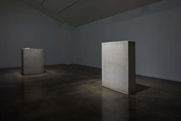 Lara Favaretto, <em>Boring</em>, 2010, Concrete, iron, 43 1/4 x 31 1/2 x 9 7/8 in (109.8 x 80 x 25 cm), and Lara Favaretto, <em>Fisting</em>, 2012 Concrete, iron, 39 1/8 x 17 1/4 x 29 1/4 in (99.4 x 43.8 x 74 cm), Museum of Contemporary Art Santa Barbara, 2019, Courtesy MCASB, Photo: Alex Blair.